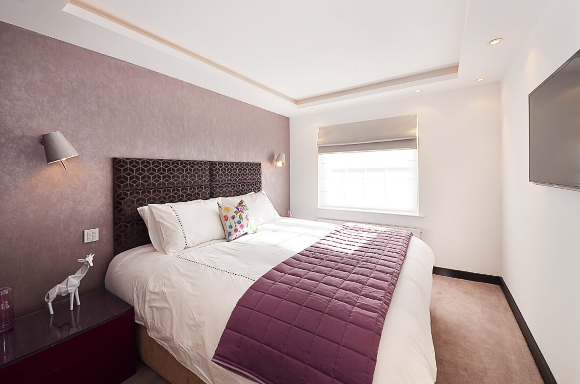 Bedroom with grey roman blind and privacy blind