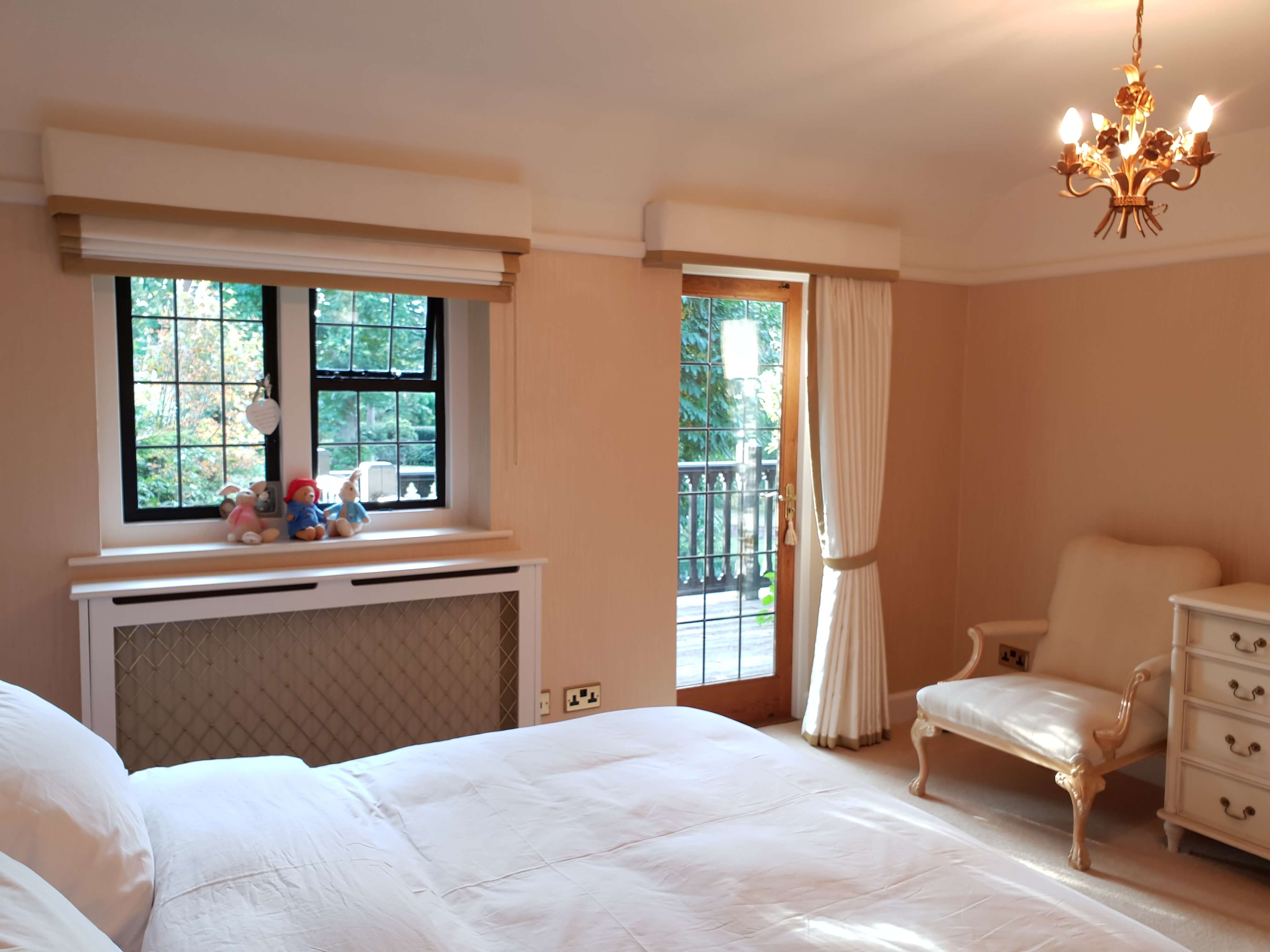 Cream roman blind and curtain wih box pelmets and gold border