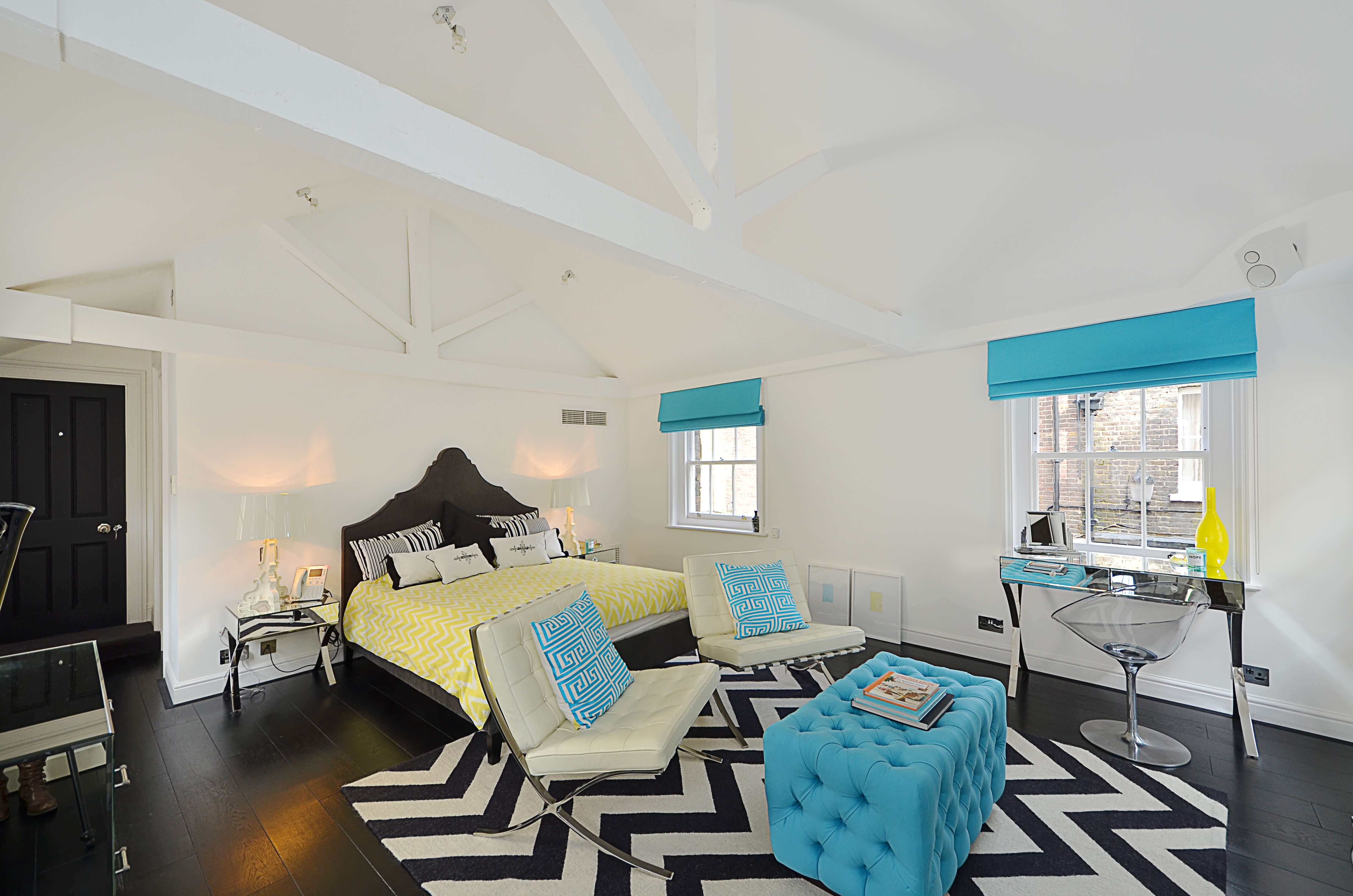 Blue roman blinds in loft space