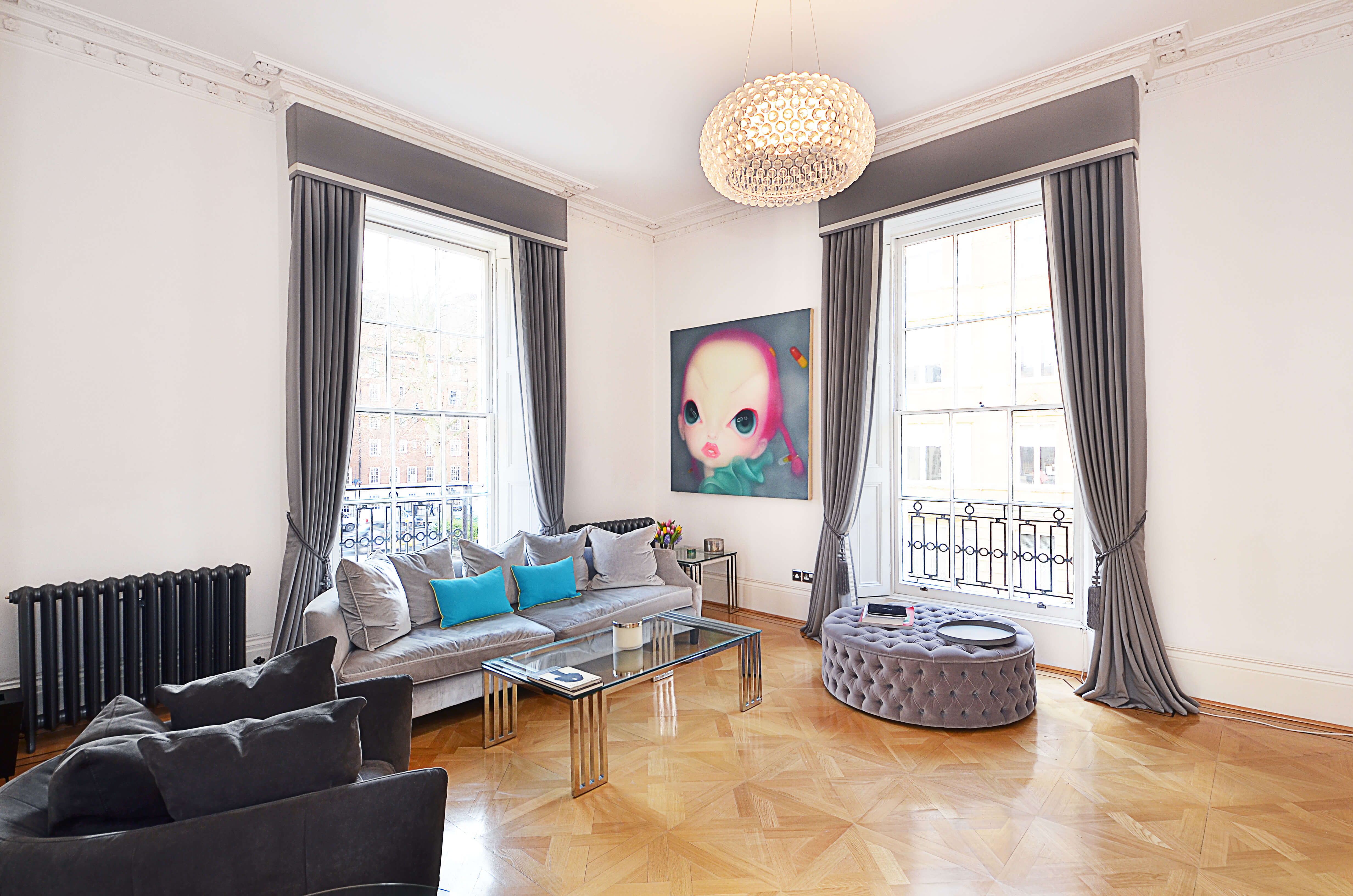 Grey bordered curtains with box pelmets and tiebacks