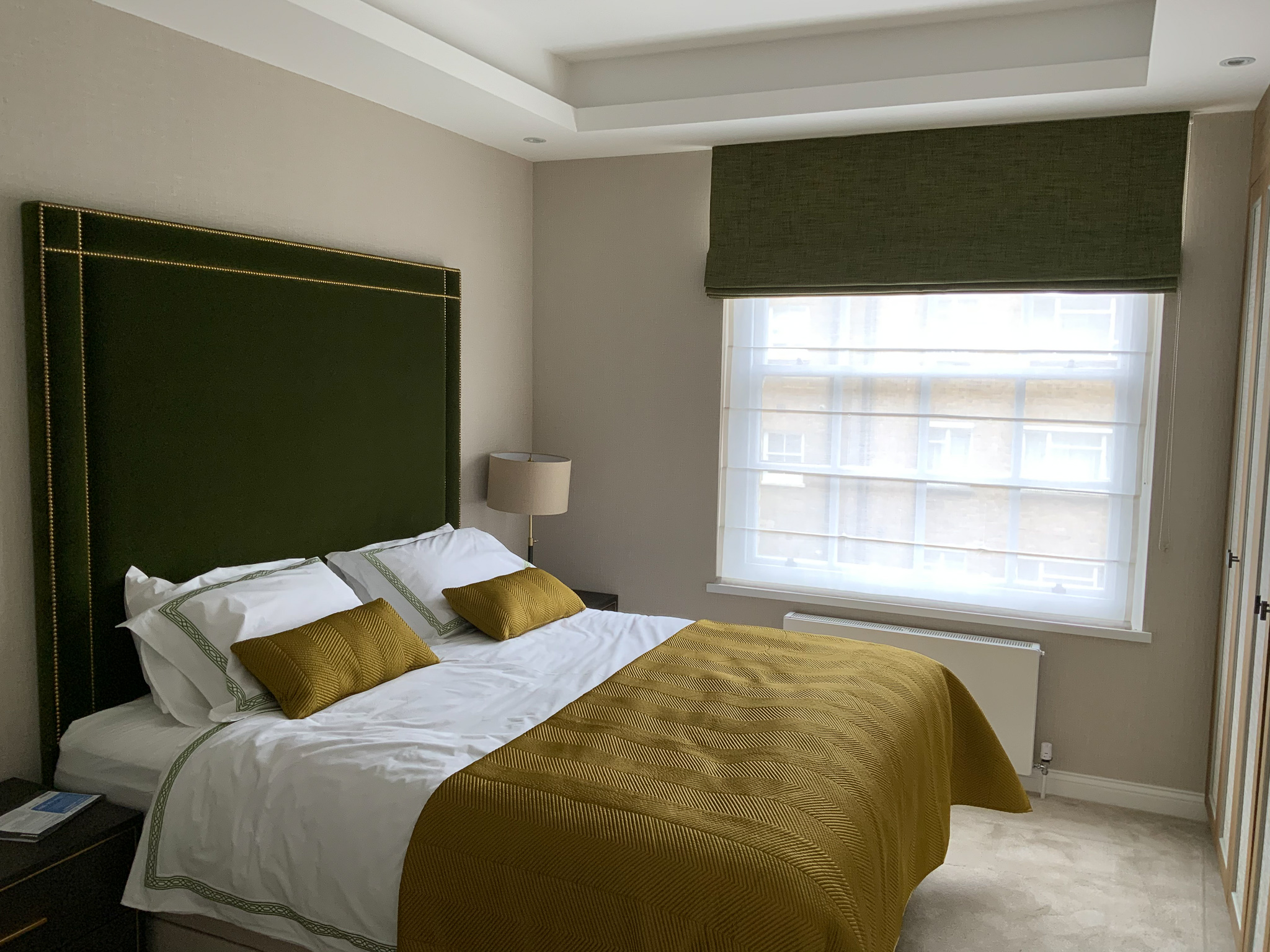Green Headboard with roman blind