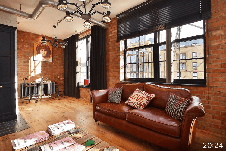 Living room with black wave curtains and black venetian blind