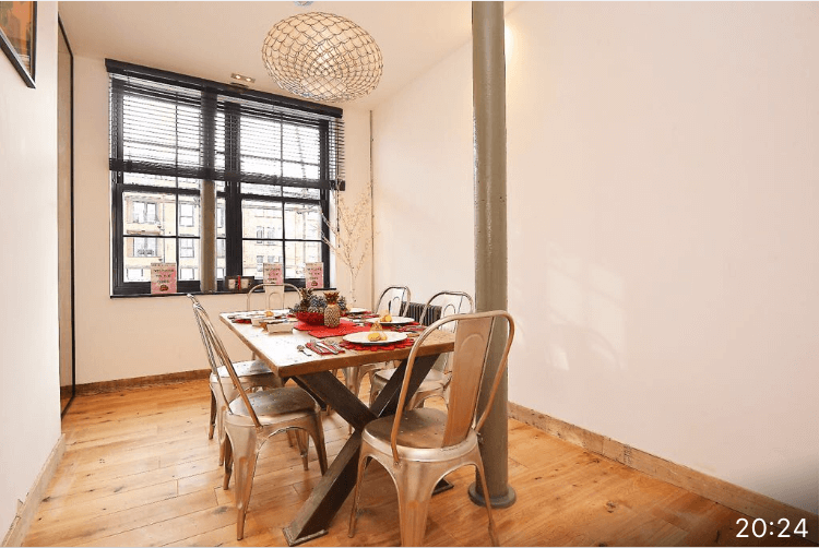 Dining room with black venetian blind