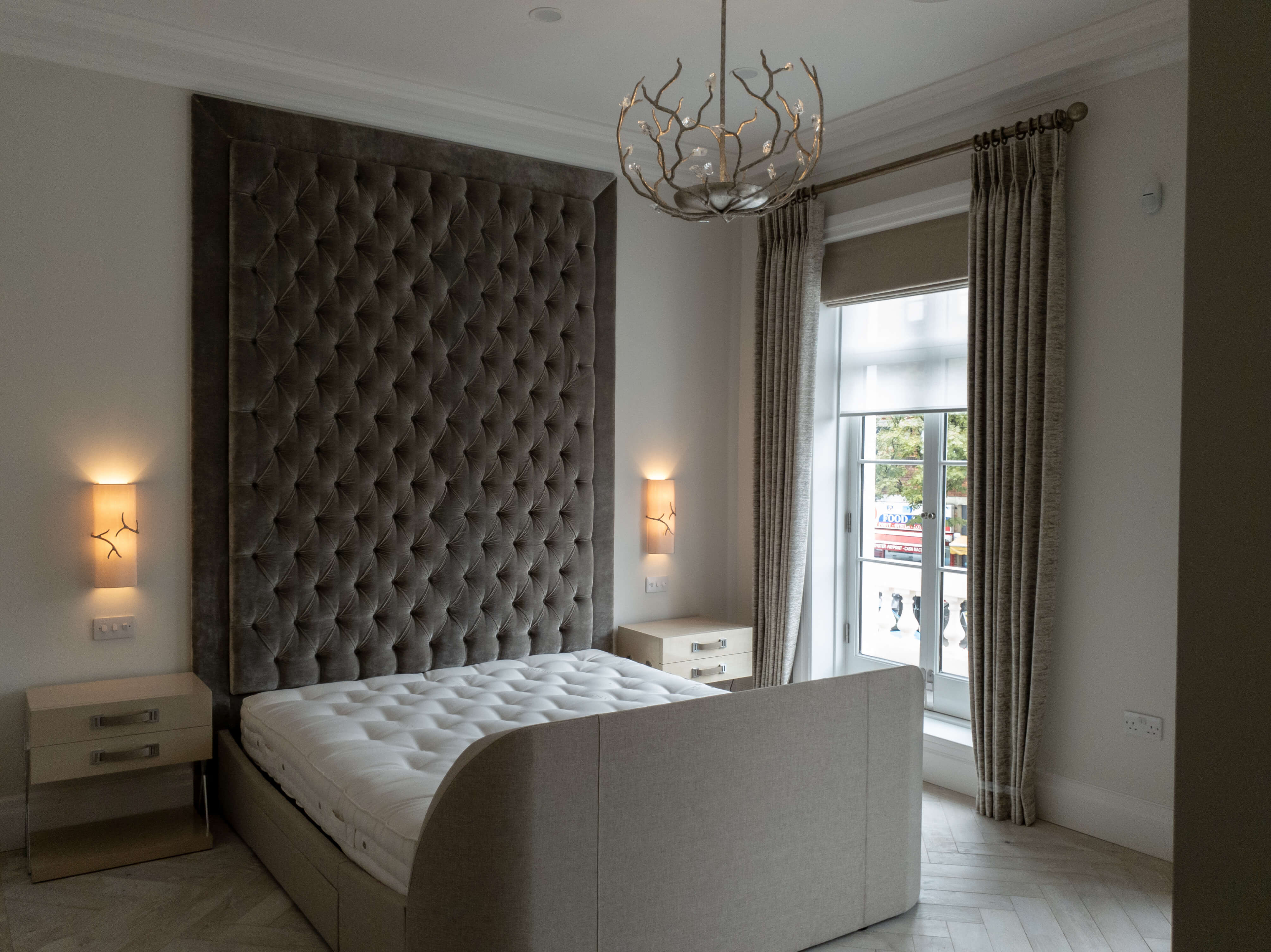 Bedroom curtains on a pole with roman blind and sheer roller blind