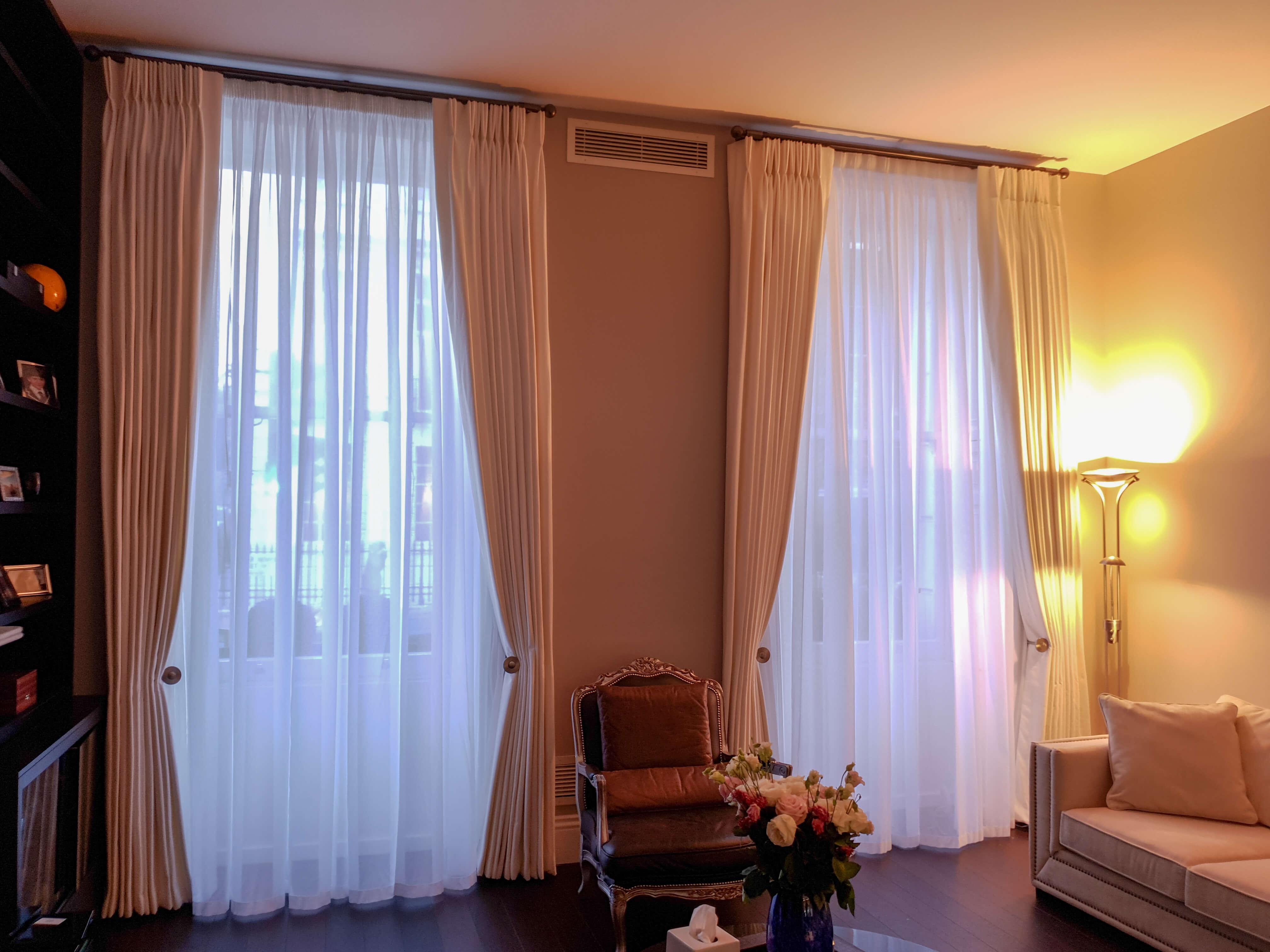 Large curtains on poles with holdbacks