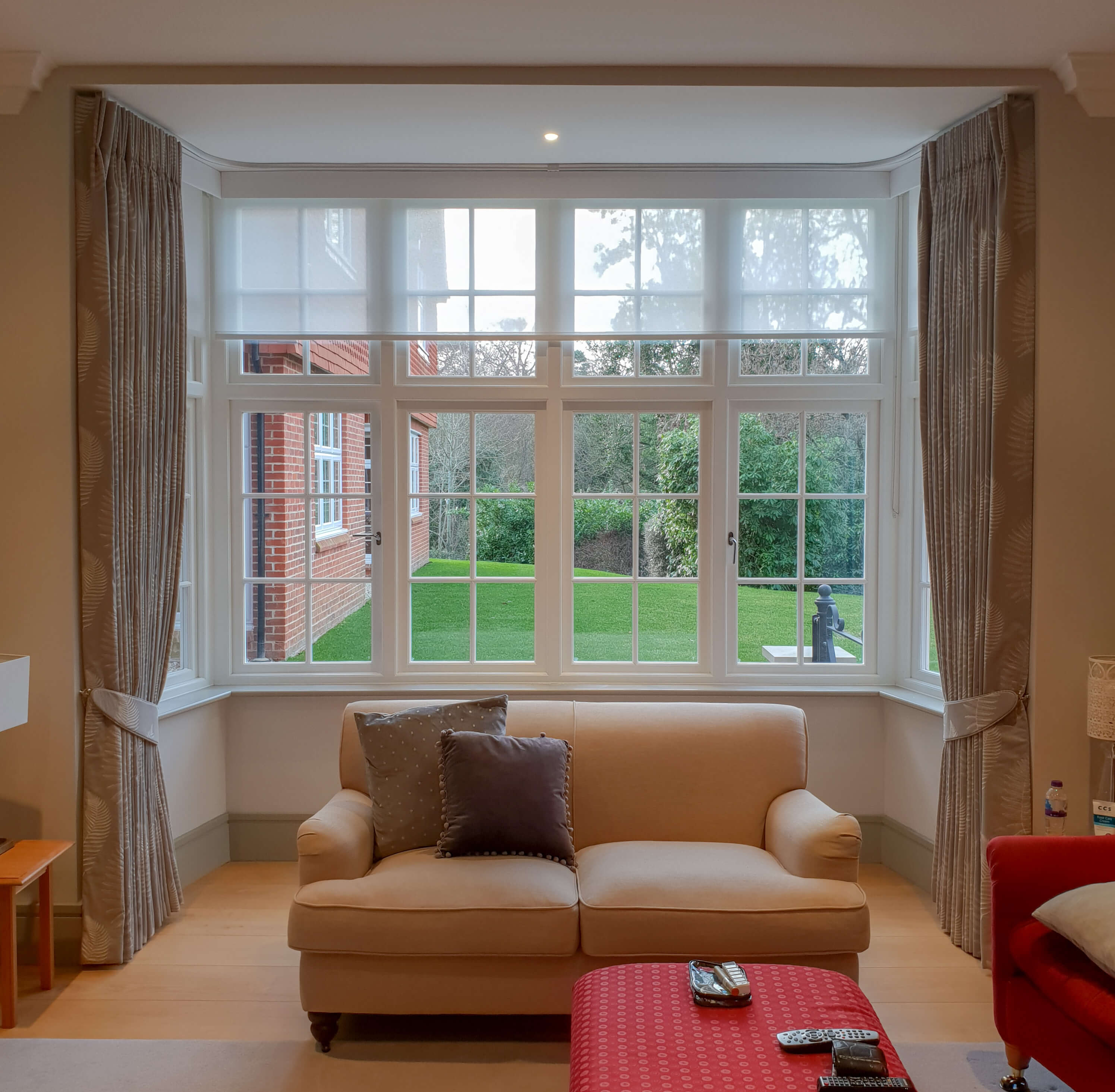Pair of curtains with white sheer roller privacy blinds