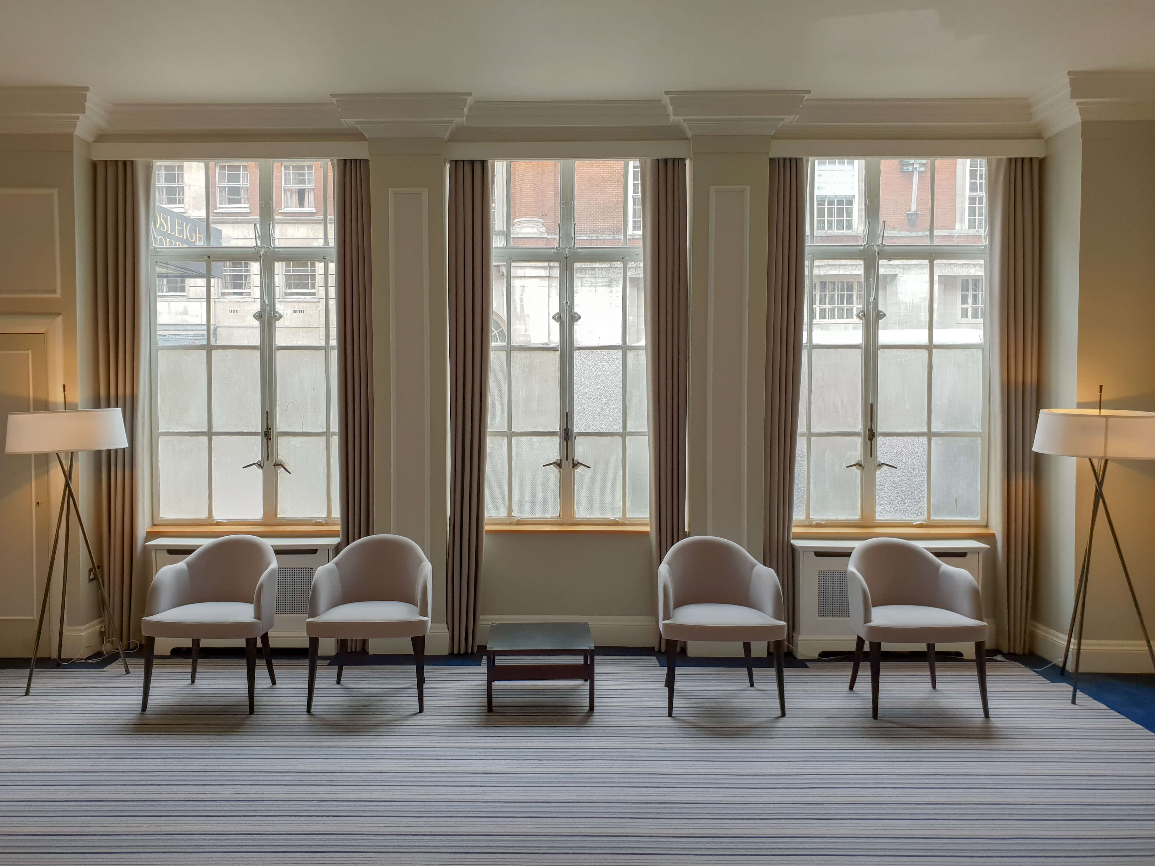 Foyer with tall dress curtains