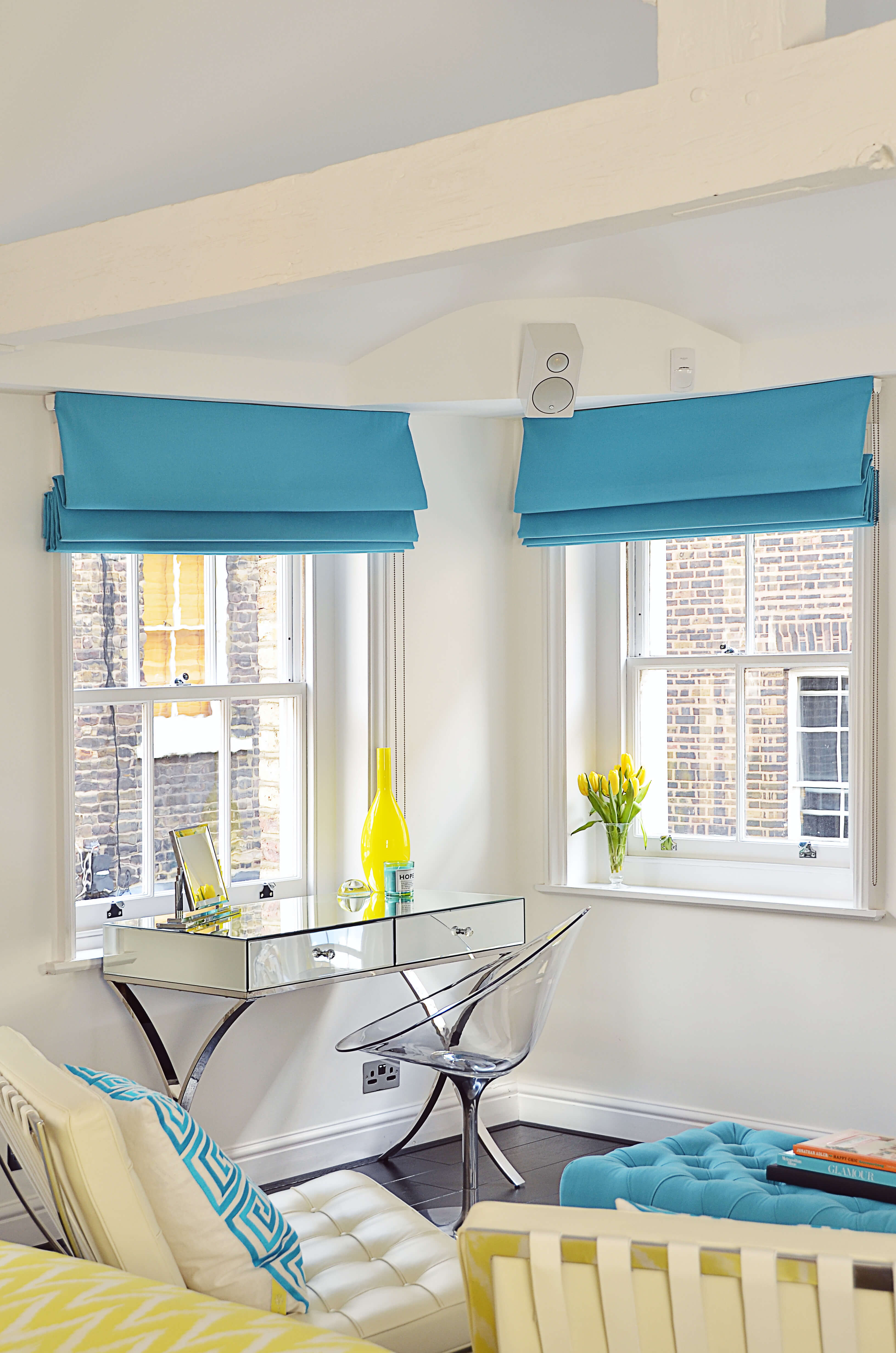 Blue roman blinds in loft space