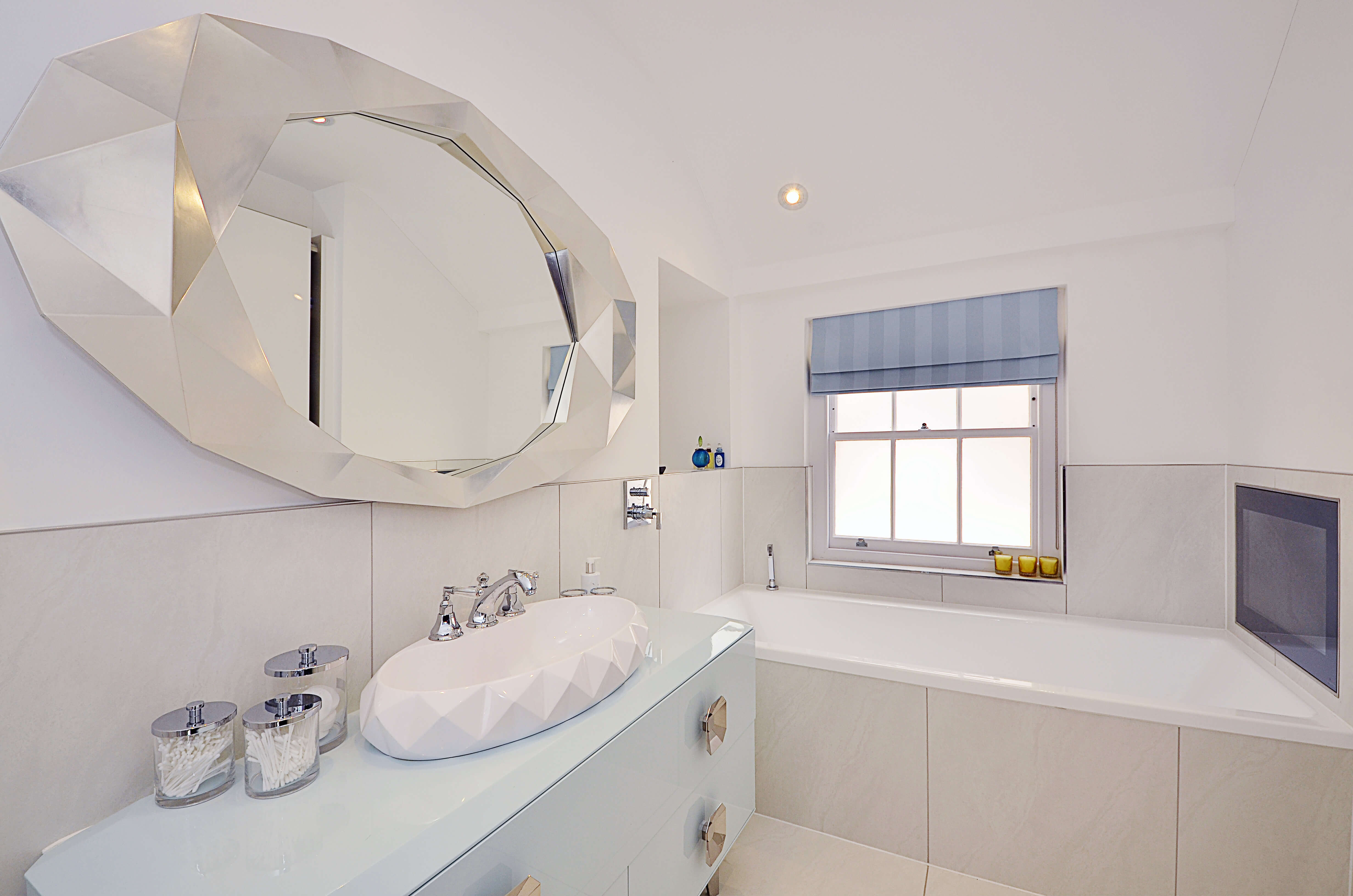 Bathroom with blue roman blind